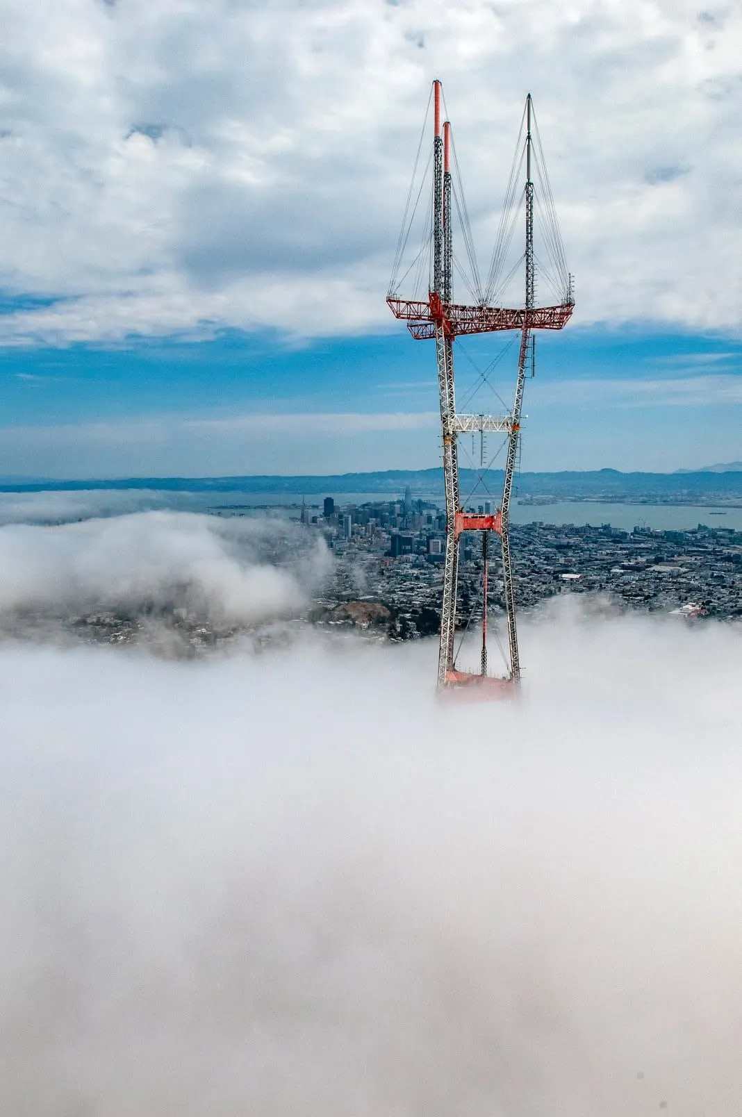 Sutro Tower rising above a layer of fog in San Francisco
