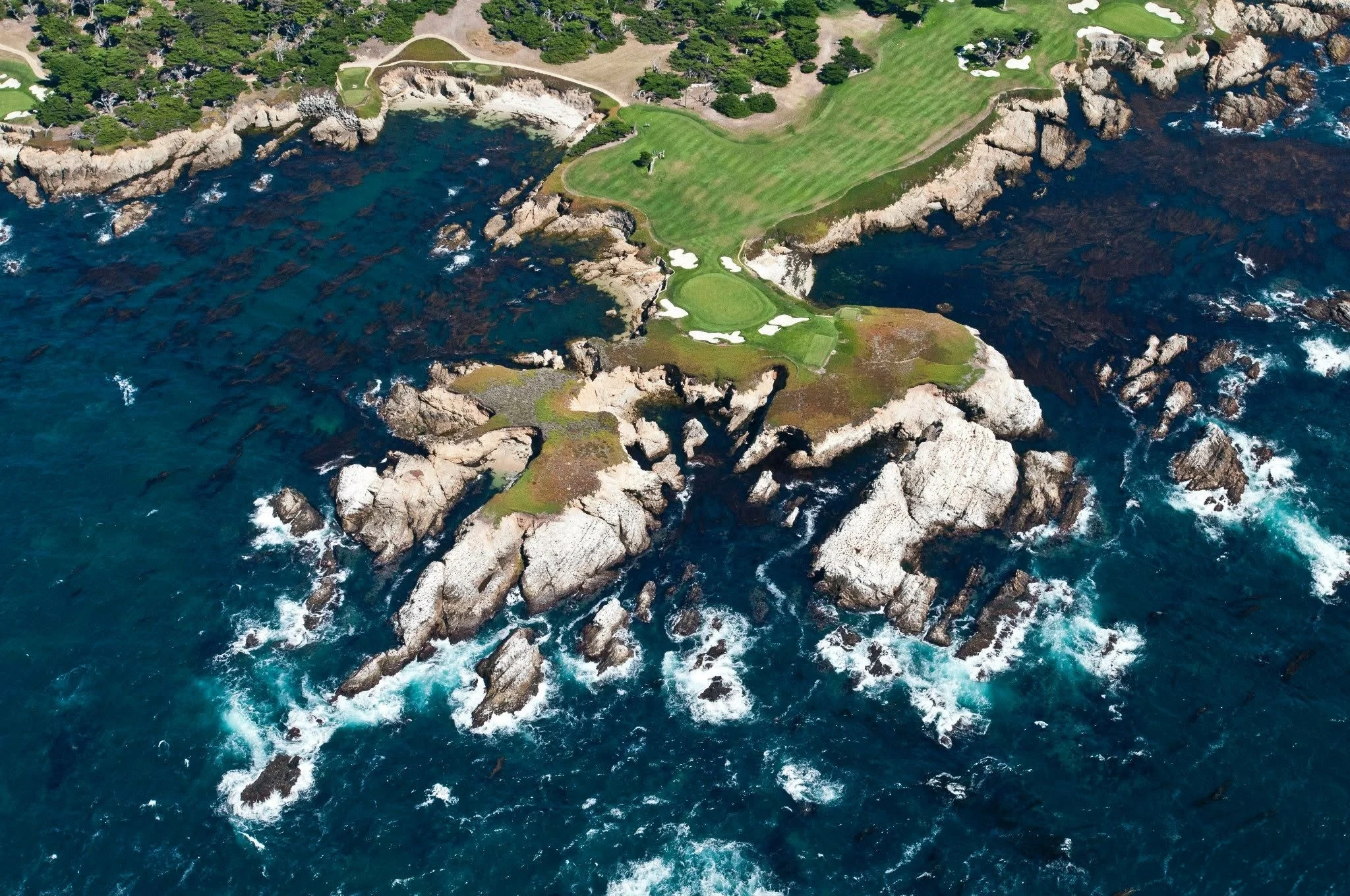 Aerial photograph of a coastal golf green at Cypress Point