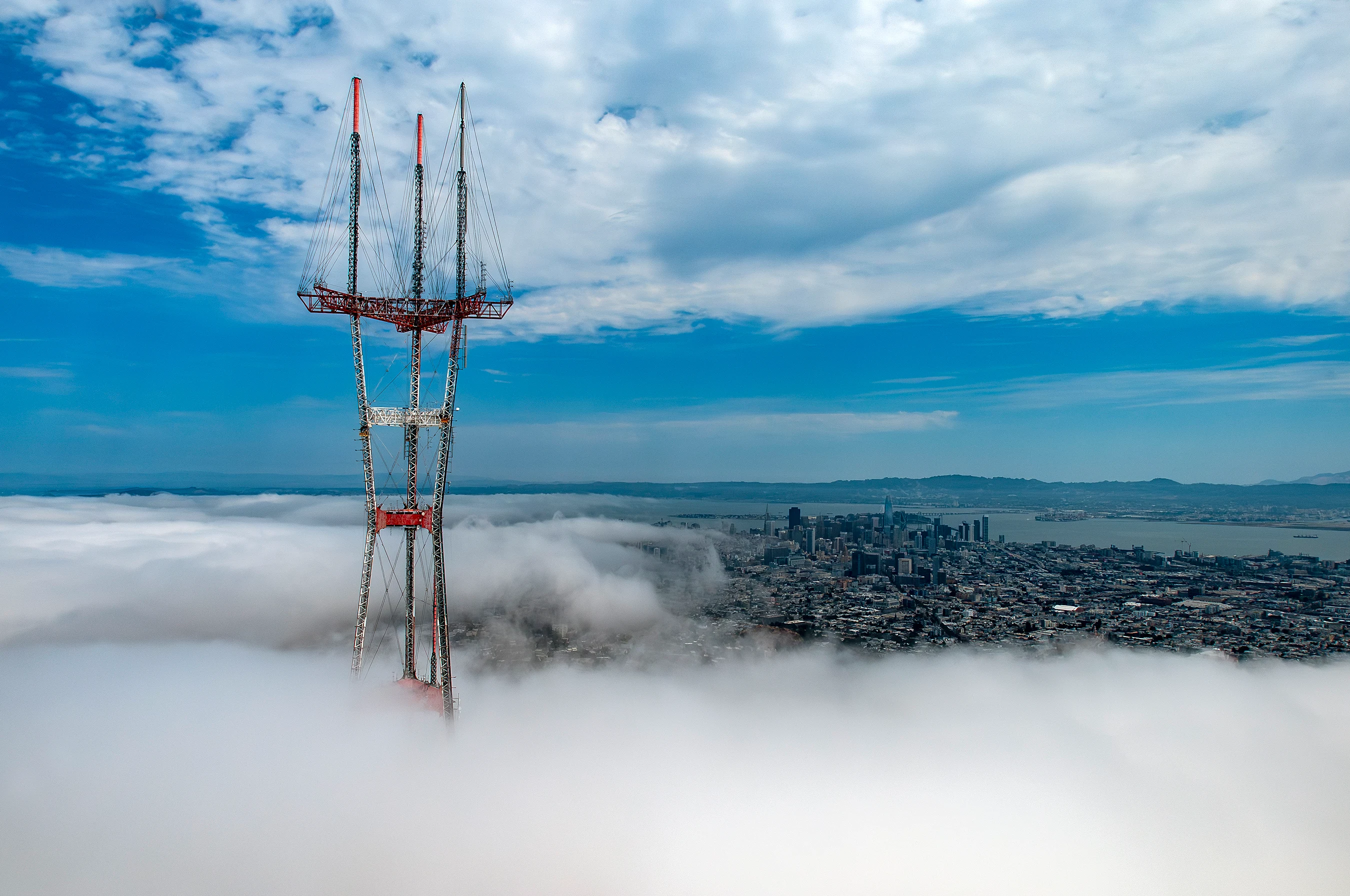 Aerial photograph of Sutro Tower standing above San Francisco fog