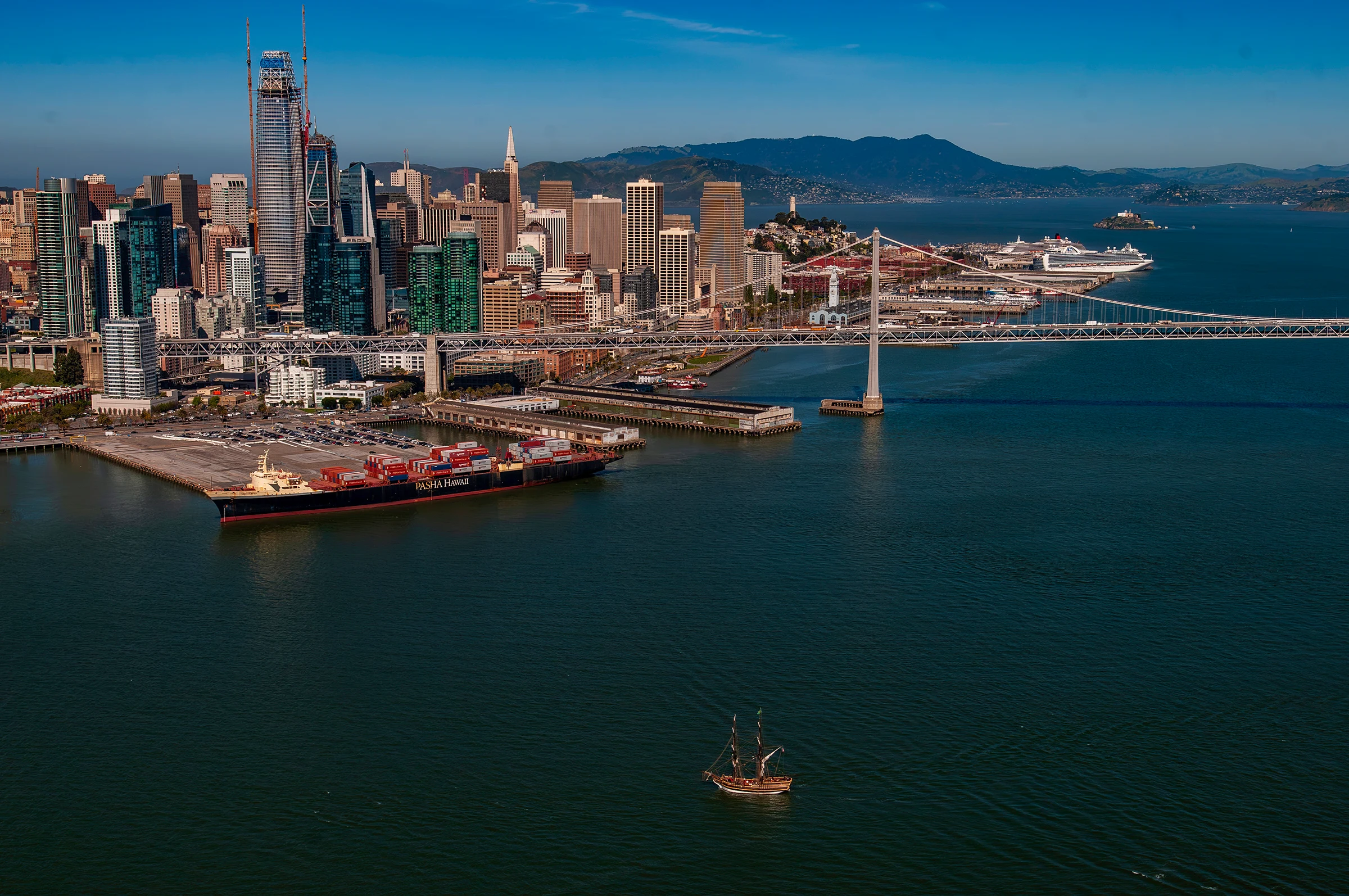 Tall ship sailing in San Francisco Bay near the city waterfront